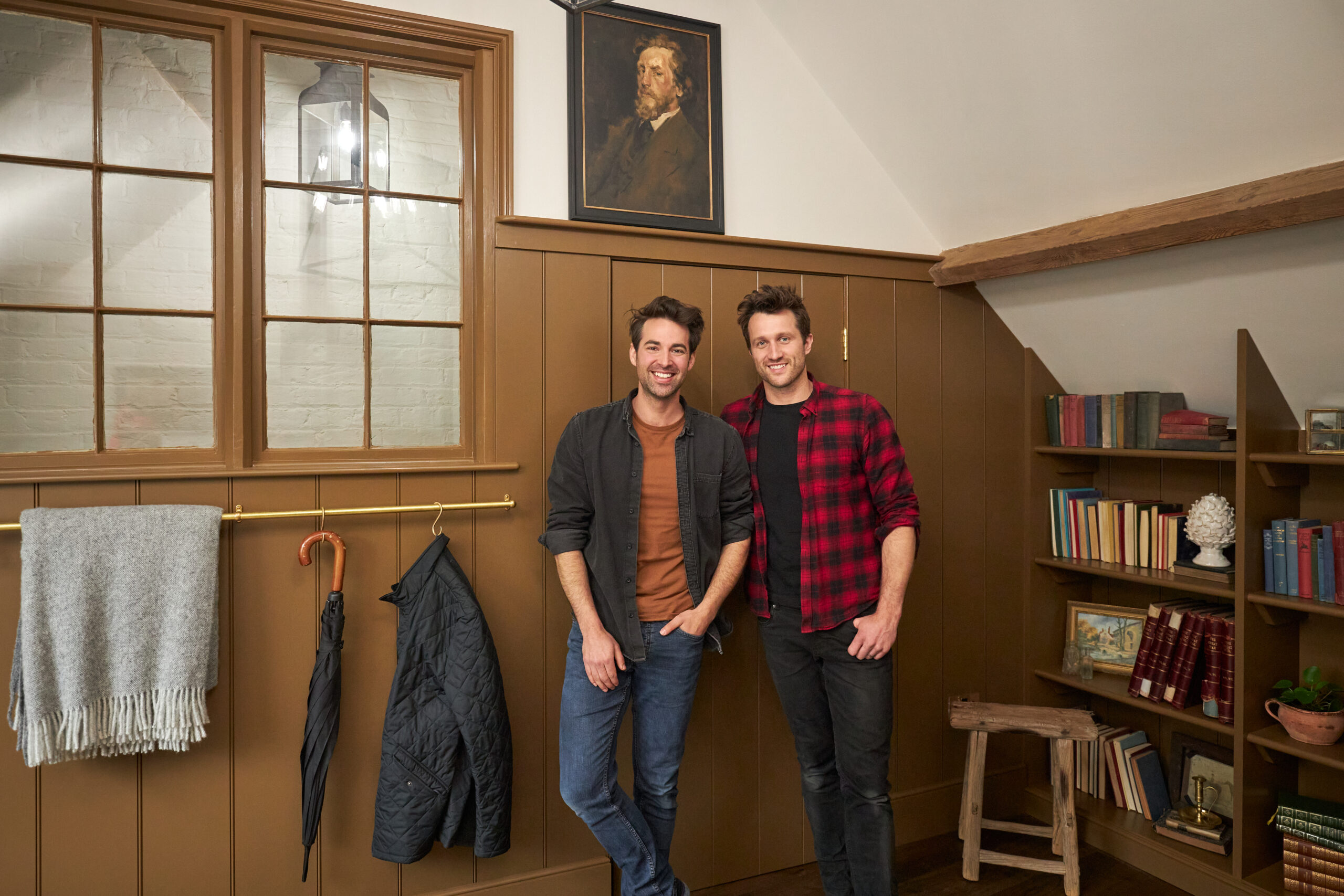 As seen on Saving the Manor homeowners Dean and Borja react to seeing their restored hay loft library and entry. Their hay loft library with new stair entrance and internal window, oak flooring with underfloor heating and cart wheel.