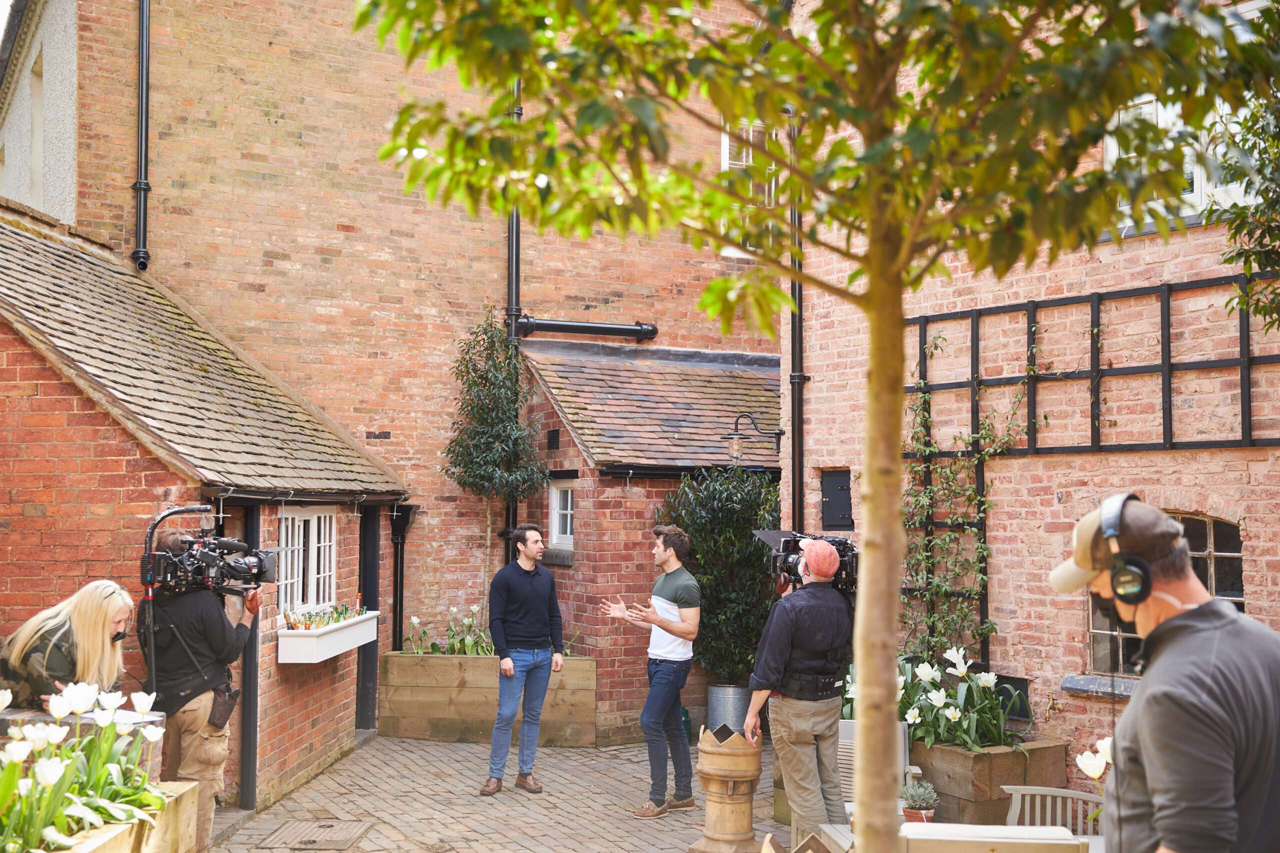 As seen on Saving the Manor homeowners Dean and Borja react to seeing their restored servant's courtyard bar and servants entrance. Their servant's courtyard with new outside bar, water feature and resorted brickwork/windows.
