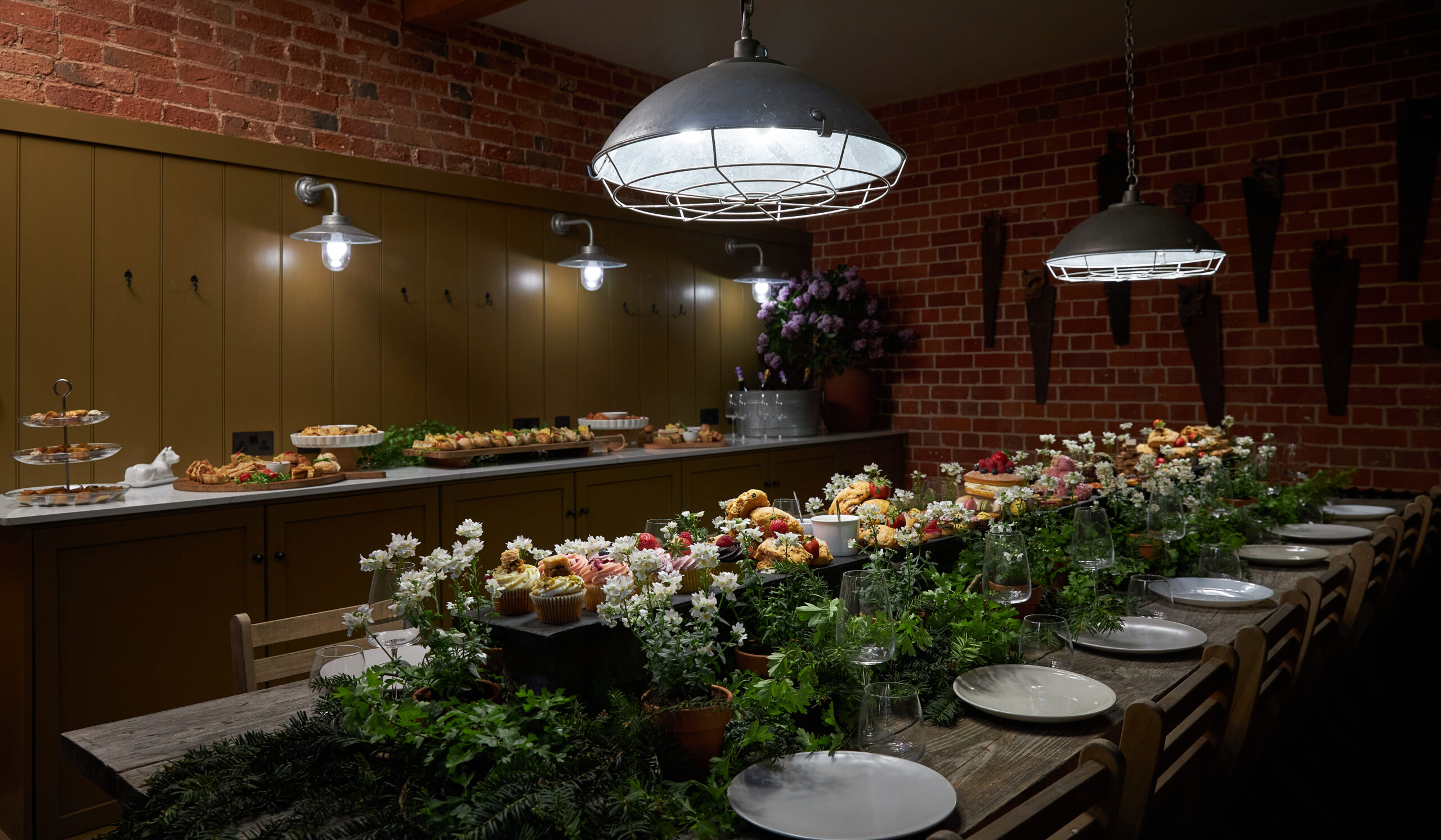 As seen on Saving the Manor homeowners Dean and Borja react to seeing their restored hay loft living room and kitchen and fully restored exterior. Their hay loft kitchen with oak flooring with underfloor heating, wood paneling and vaulted ceiling.